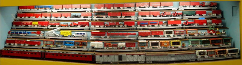 [Display case with 6 rows of rail cars totally nearly 100 individual wagons.]